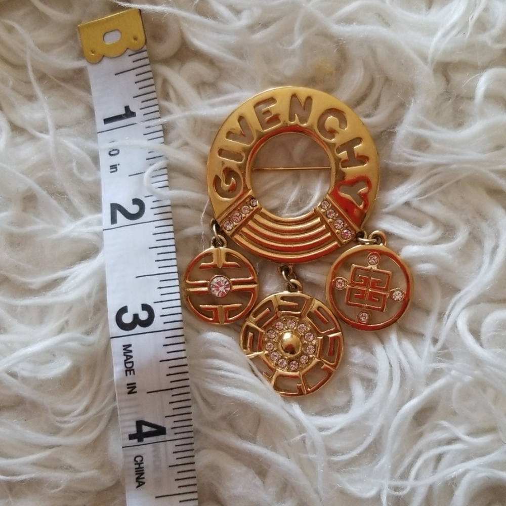 Gold Givenchy pin brooch